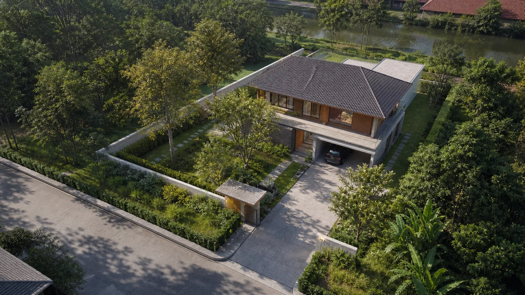 มุมสูงของบ้านร่วมสมัยบนที่ดินเขตร้อน มีทางเข้า พื้นที่สีเขียว และระยะรอบอาคาร